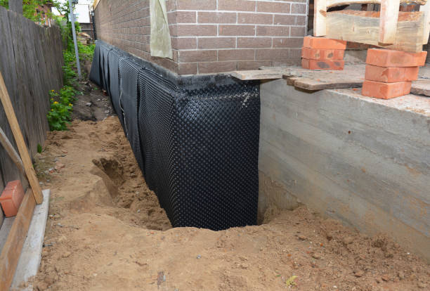 Happy homeowners after waterproofing job in Locust Dale